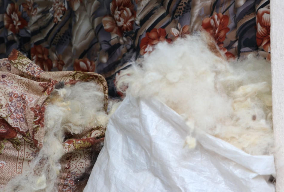 Abu Nimir prepares quilts in summer so that it is ready for customers in winter.